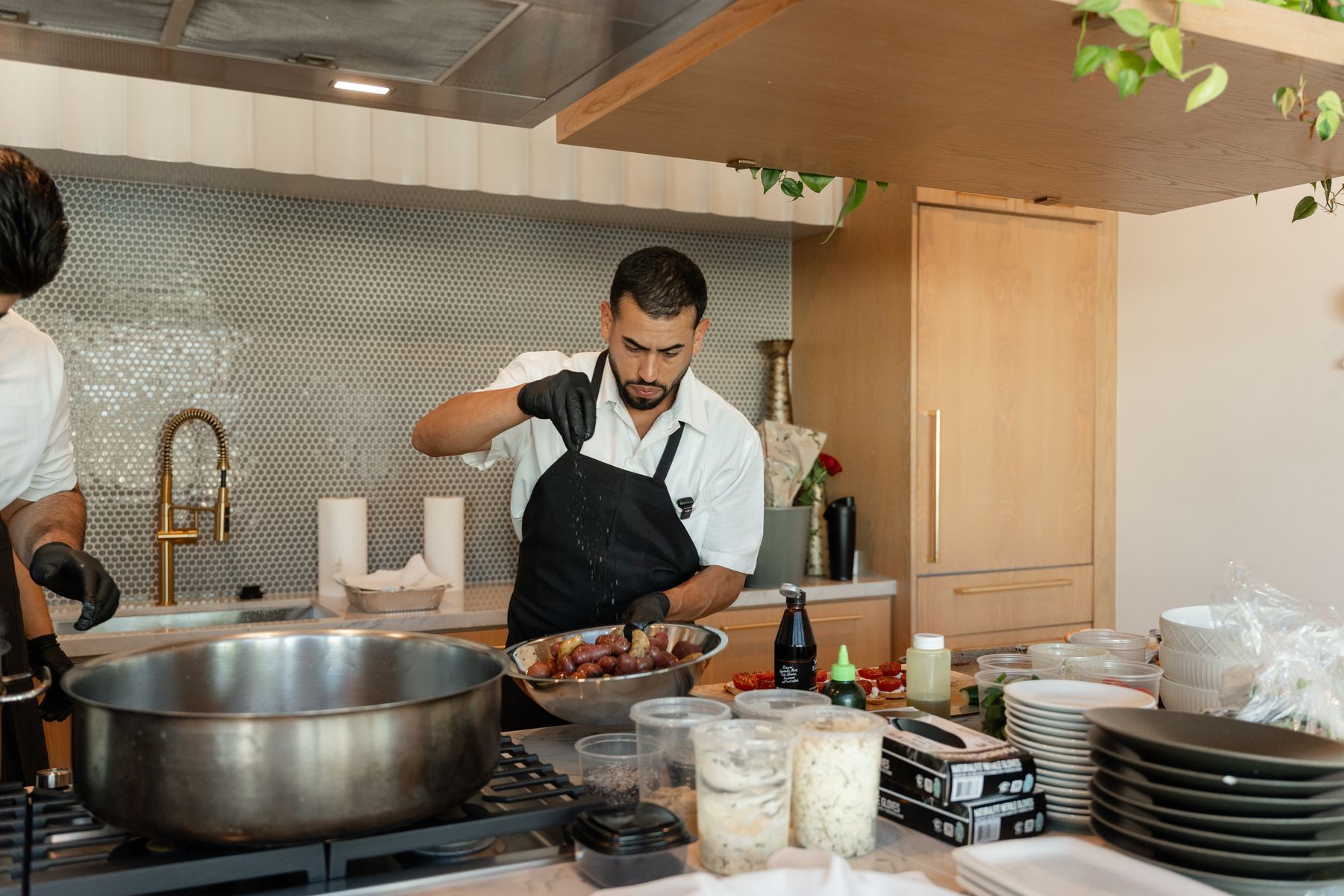 Edgar cooking in a client’s kitchen