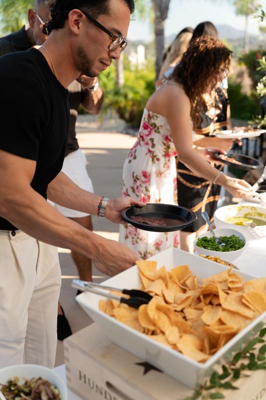 Guests at the live taco bar